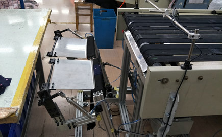 自動收料裝置在服裝加工粘襯技術中的應用 自動收料裝置在服裝加工粘襯技術中的應用